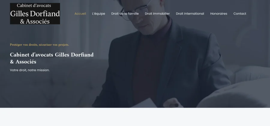 Page d'accueil du site du Cabinet d'avocats Gilles Dorfiand & Associés sur fond photographique sombre.